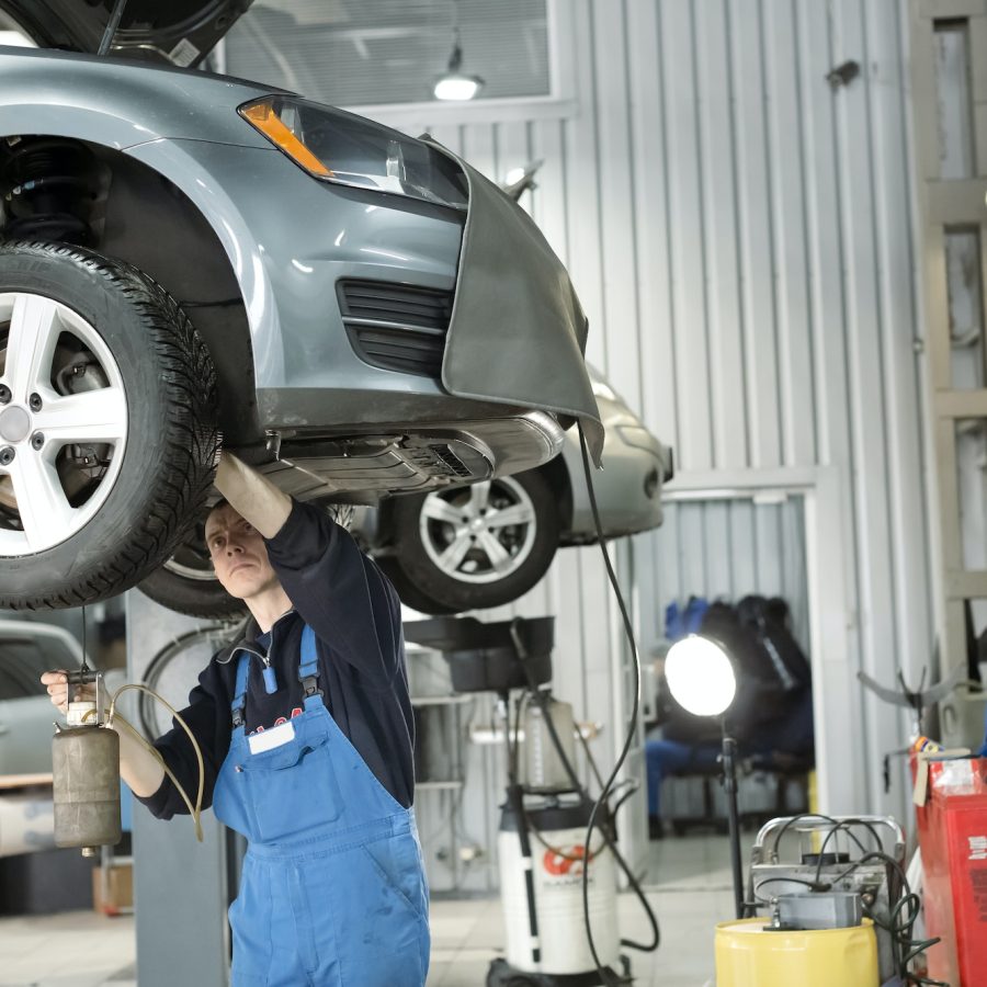 blow-the-air-in-break-system-car-mechanic-is-under-the-car
