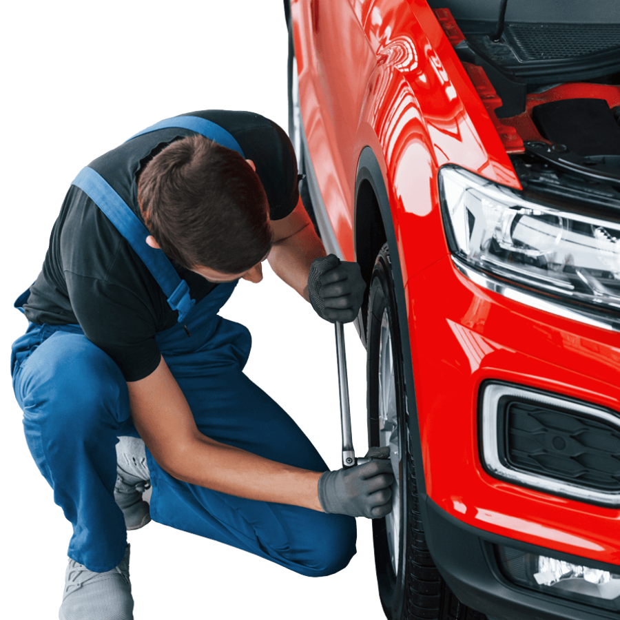 man-in-uniform-changing-tire-of-automobile-concep-1